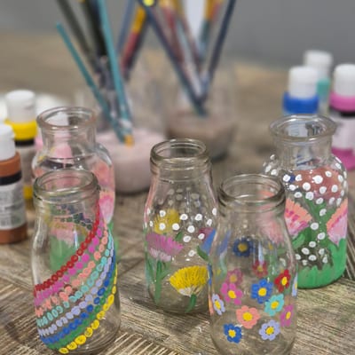Hand-painted glass jars with flowers